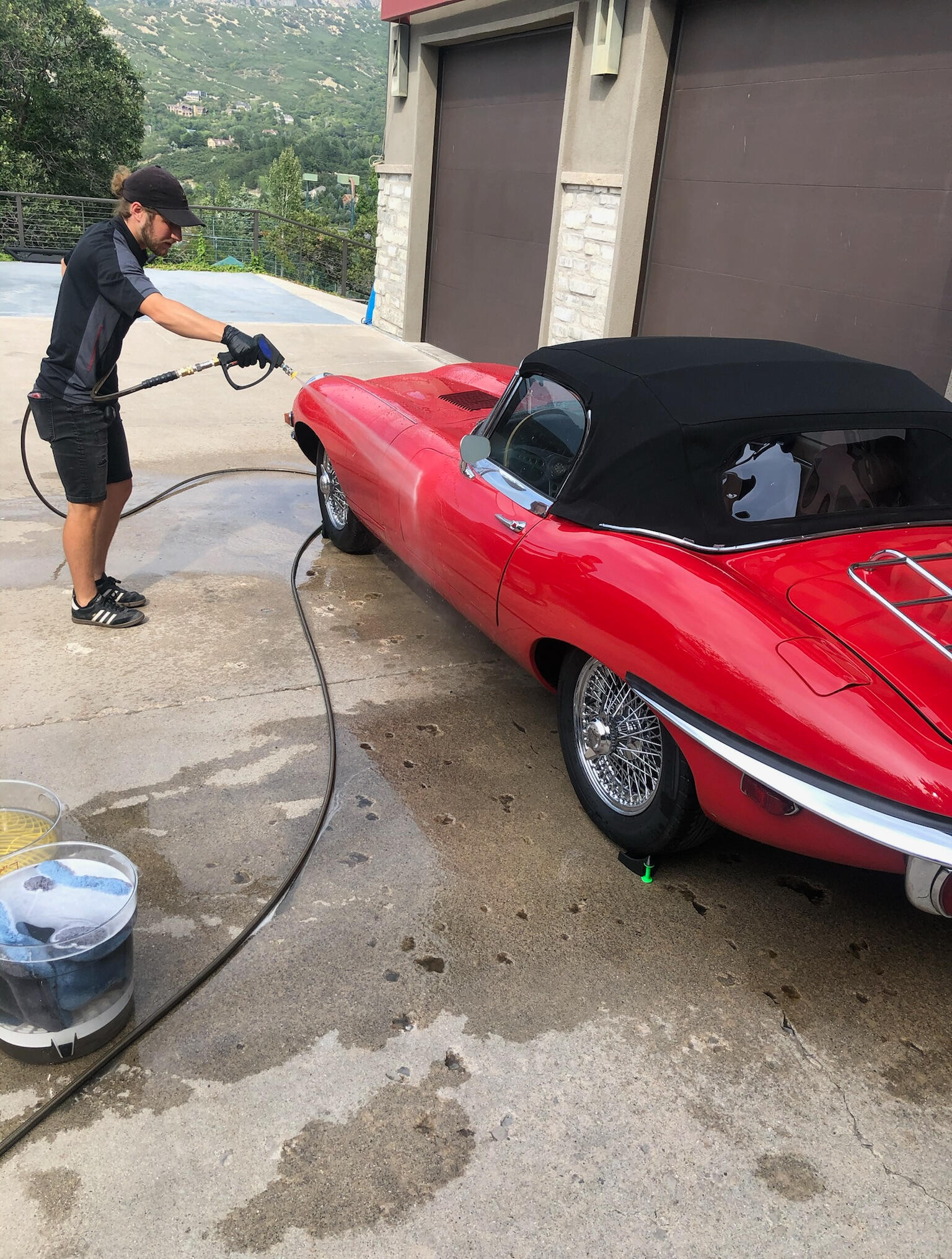Hunter washing an E-Type